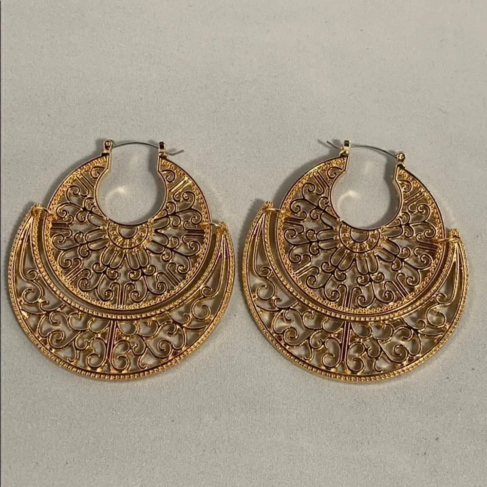 Large gold colored earrings